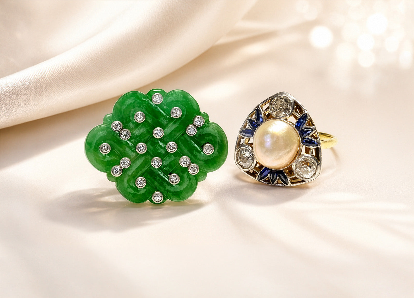 DSF Antique Jewelry press coverage image featuring a jade diamond brooch and pearl sapphire diamond ring