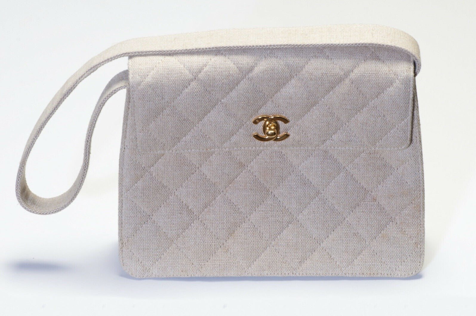 CHANEL Paris 1990’s CC Beige Quilted Canvas Flap Shoulder Bag