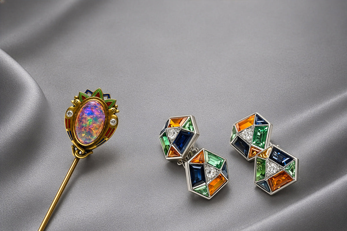 Art Nouveau opal and diamond stick pin with Art Deco sapphire platinum cufflinks displayed on silk