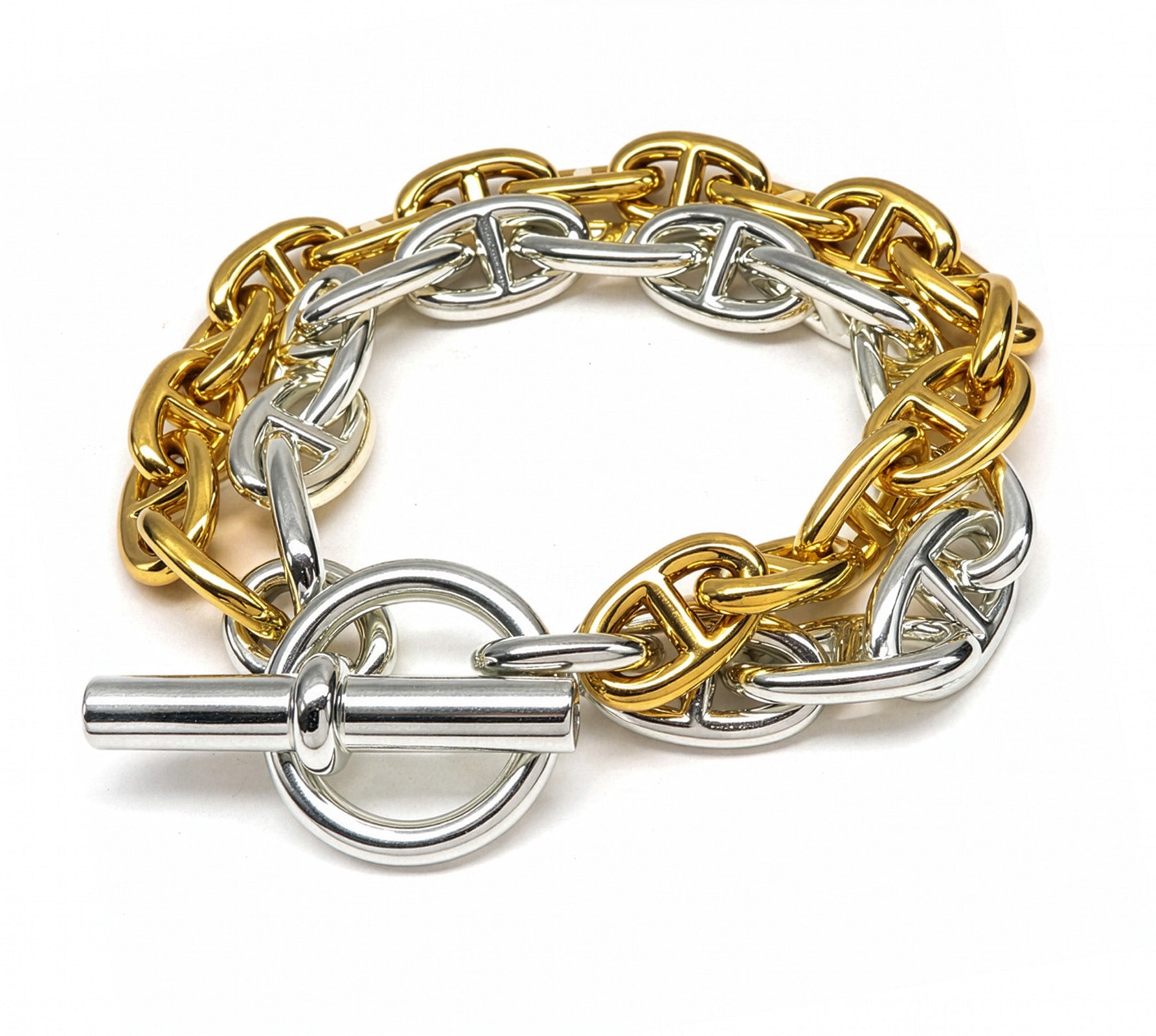 Hermès Chaine d’Ancre GM bracelet in 18K gold and sterling silver with two tone interlocking chain links and toggle clasp