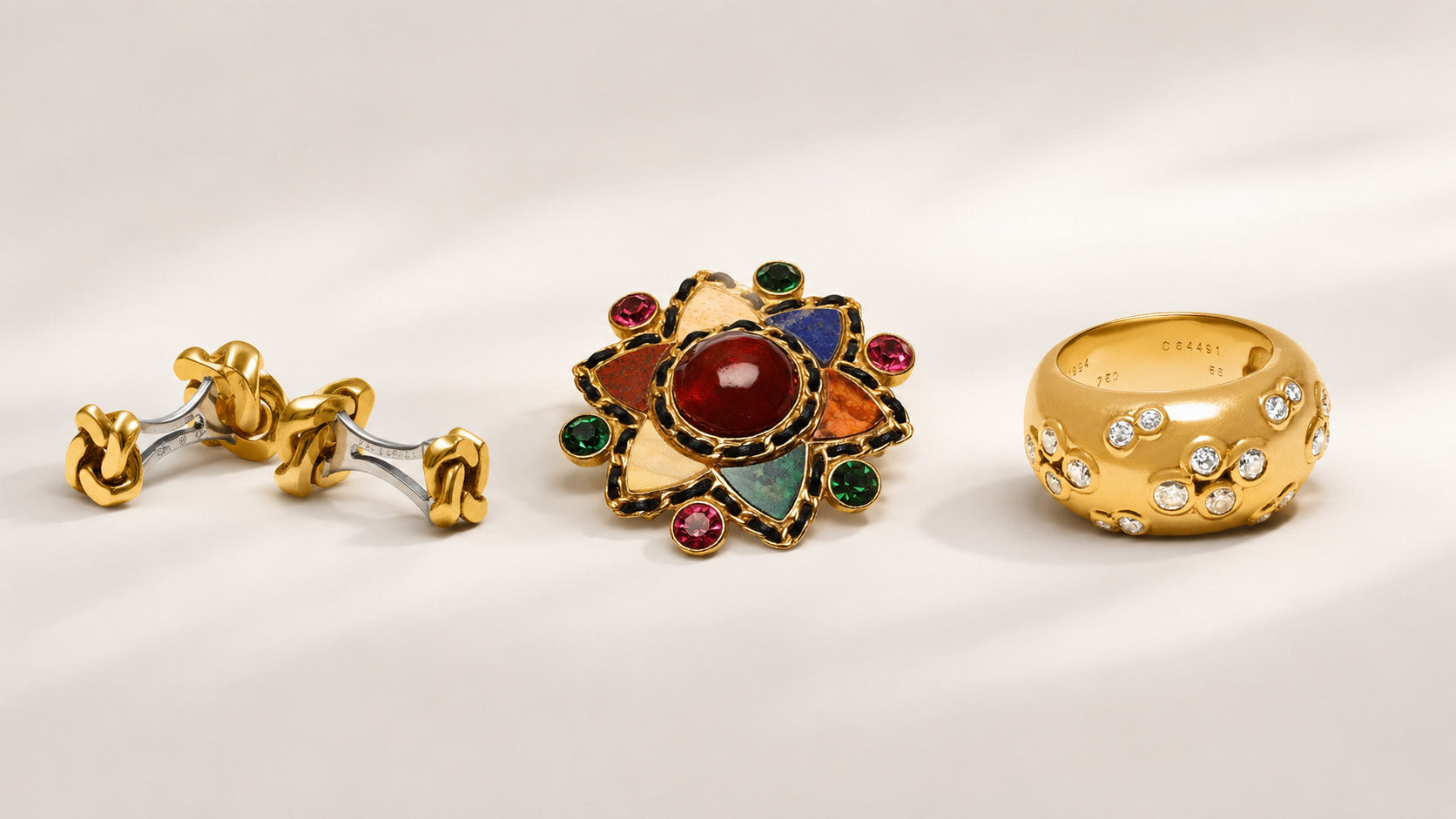 Luxury signed designer jewelry collage featuring Van Cleef & Arpels cufflinks, a Chanel brooch, and a Cartier diamond gold ring