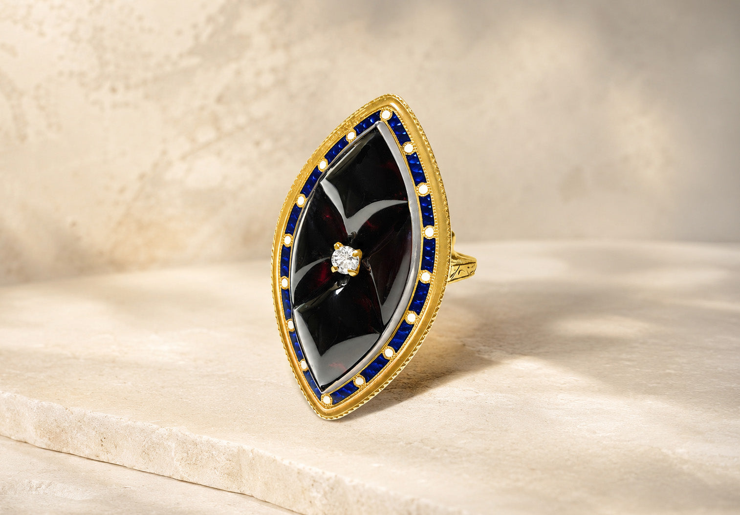 Antique gold garnet diamond and blue enamel marquise ring at DSF Antique Jewelry