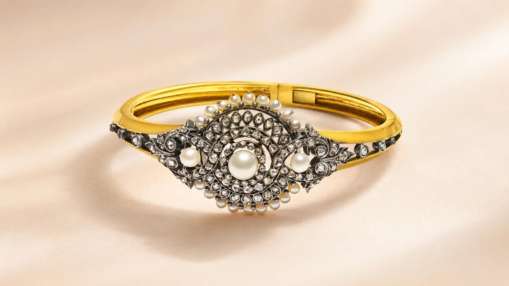 Antique pearl and diamond bangle bracelet representing the importance of provenance in fine jewelry, featured by DSF Antique Jewelry