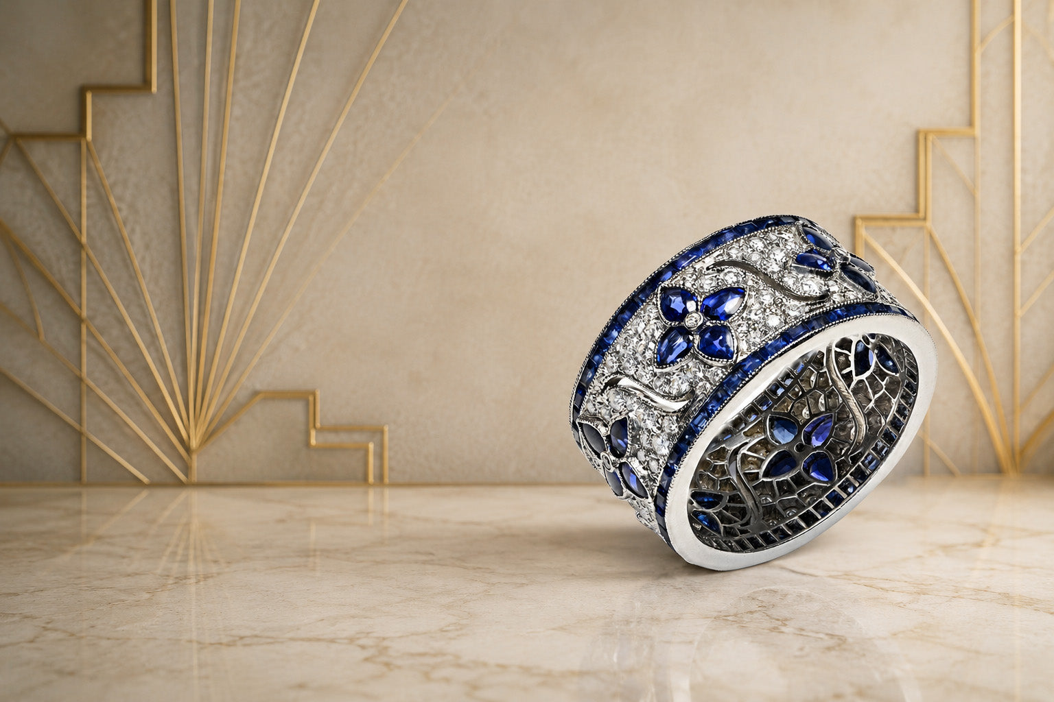 Art Deco style diamond and sapphire wide band ring on a luxury geometric background
