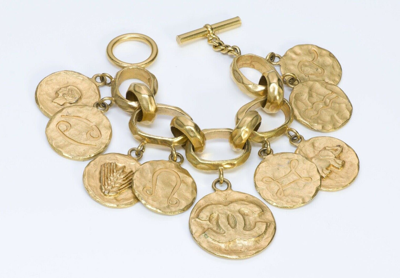 CHANEL CC Fall 1993 Hammered Zodiac 9 Charm Bracelet - DSF Antique Jewelry