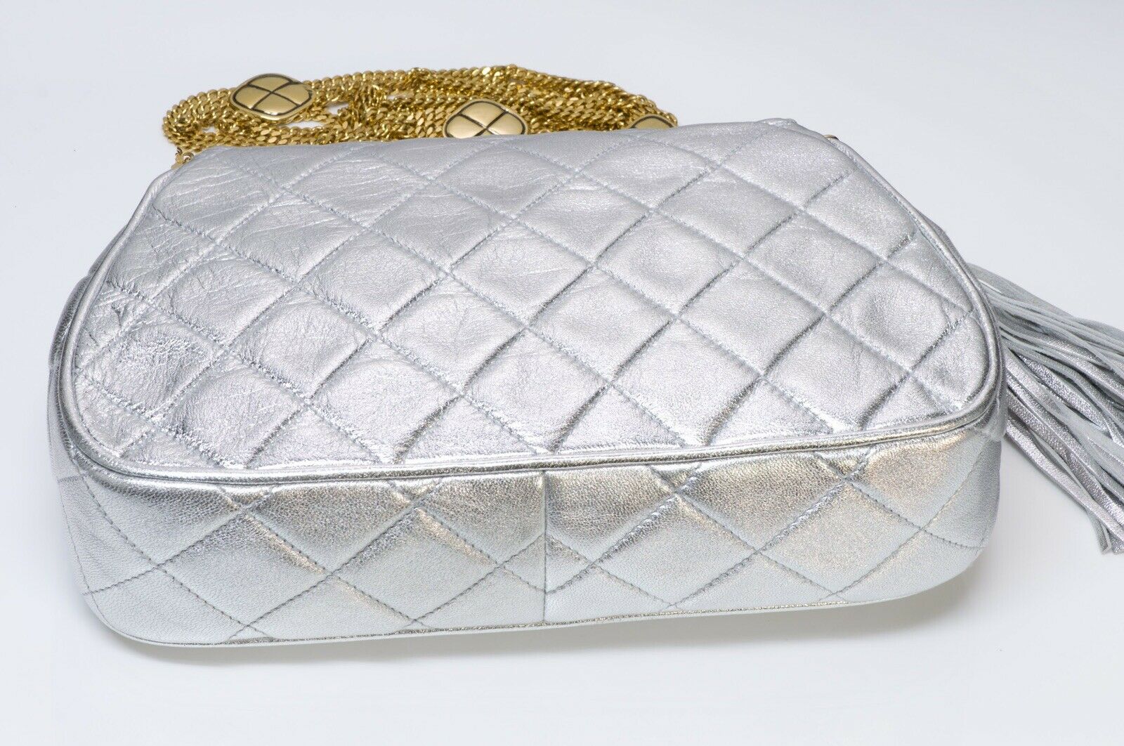 CHANEL CC Silver Metallic Quilted Leather Tassel Chain Bag