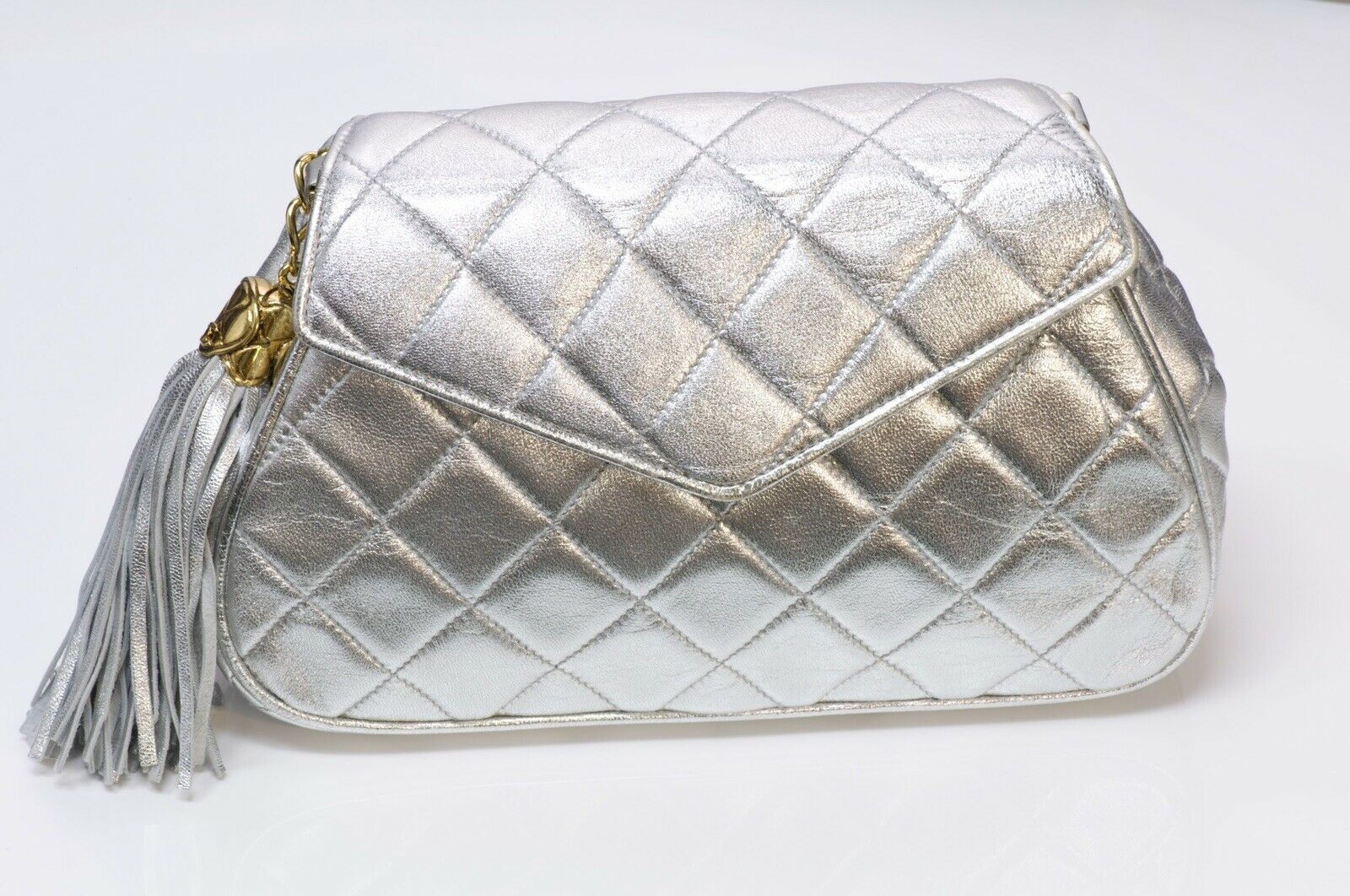 CHANEL CC Silver Metallic Quilted Leather Tassel Chain Bag - DSF Antique Jewelry